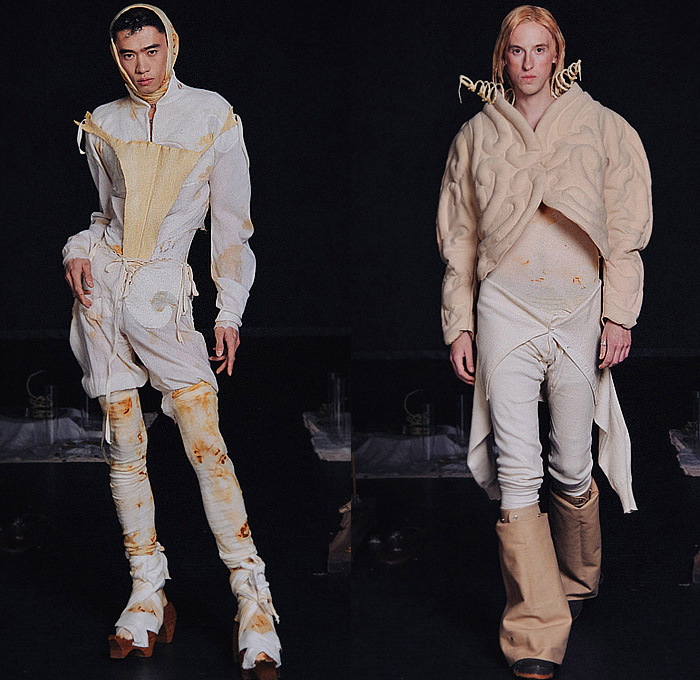 Zoe Gustavia Anna Whalen 2025-2026 Fall Autumn Winter Mens Collection - New York Fashion Week NYFW - 18th Century Victorian Medieval Armor Metal Sculpture Plates Spoons Faces Knit Shawl Turtleneck Quilted Puffer Corset Lantern Hem Pleats Long Sleeve Shirt Laces Baggy Tapered Denim Jeans Stains Harness Tights Leggings Wrapped Bandages Embossed Engraved Thigh High Boots Gaiters