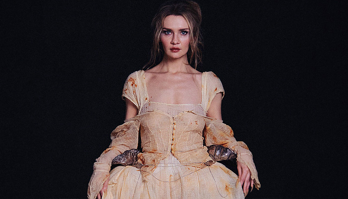 Zoe Gustavia Anna Whalen 2025-2026 Fall Autumn Winter Womens Collection - New York Fashion Week NYFW - 18th Century Victorian Medieval Armor Metal Metallic Sculpture Plates Lace Embroidery Robe Crinoline Mesh Skirt Corset Shapewear Tied Puppies Puff Ball Frayed Raw Hem Strapless Open Shoulders Peplum Dress Gown Eveningwear Wood Wooden Sticks Lantern Hem Stains Layers Knit Knitwear Wrap Wrapped Wide Leg Baggy Loose Denim Jeans Leg Warmers Arm Warmers Boots