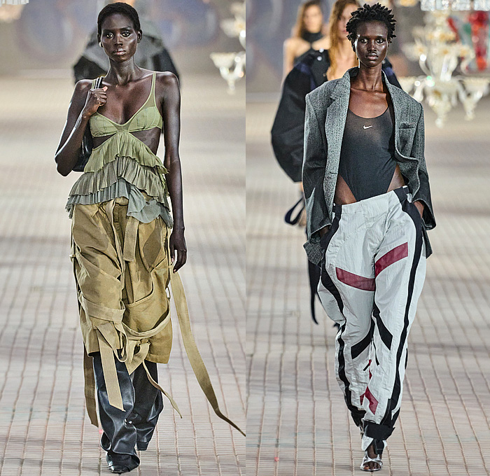 The Attico 2025 Spring Summer Womens Runway Collection - Milan Fashion Week MFW Italy - The Sound of Breaking Glass - Bralette Crop Top Midriff Strings Lingerie Camisole Bandage Feathers Threads Fringes Crystals Mesh One Shoulder Gown Wrap Tied Wide Leg Parachute Cargo Pants Culottes Flapper Dress Hoodie Sweatshirt Anorak Noodle Strap Shredded Lace Sheer Tulle Organza Twist Halterneck Silk Satin Blazer Jacket Tiered Ruffles Blouse Patchwork Gladiator Pumps