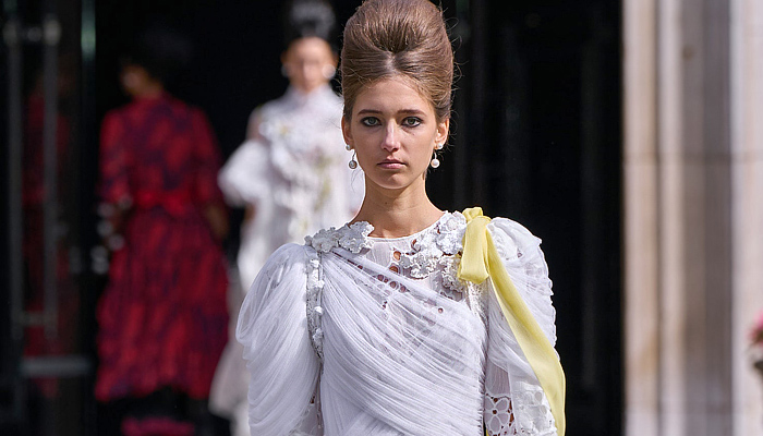 Bora Aksu 2025 Spring Summer Womens Runway Collection - London Fashion Week LFW - Sheer Tulle Organza Lace Embroidery Dress Knit Cardigan Sweater Jumper Crochet Mesh Flowers Floral Plants Bows Ribbons Opera Gloves Peter Pan Collar Wrap Draped Pink Red Accordion Pleats Blazer Jacket Hearts Blouse Stripes Capelet Pellegrina Polka Dots Onesie Jumpsuit Turtleneck Pussycat Bow Grandma Chic Leg O'Mutton Shoulders Tights Leggings Tutu Sunglasses Mary Janes Handbag