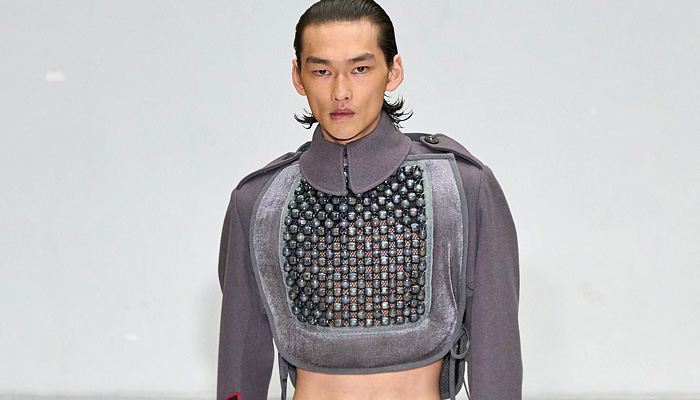 Duran Lantink 2025 Spring Summer Mens Looks - Paris Fashion Week PFW - Helmet Bag Sheer Organza Long Sleeve Crop Top Midriff Car Beads Seat Cover Military Shirt Onesie Romper Coveralls Jumpsuit Halterneck Hypnotic Stripes Bulge Plants Flowers Floral Wide Sleeves Elongated Cycling Shorts Wide Leg Baggy Loose Manskirt Padded Speedos Leggings Tights Boots